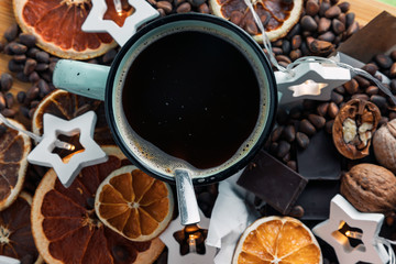 Festive still life of a Cup of coffee, chocolate, nuts and dried fruits