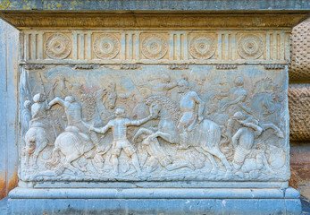 Bas relief on the pedestal at the entrance of Palace of Charles V in the Alhambra Palace in Granada. Andalusia, Spain.
