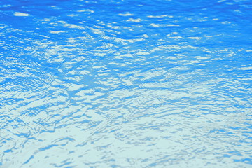 Obraz premium Surface of blue swimming pool,background of water in swimming pool. Water background blue.