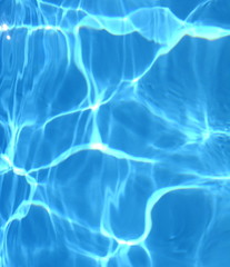 Fototapeta na wymiar Surface of blue swimming pool,background of water in swimming pool. Water background blue.