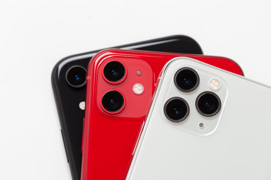 Three smartphones close-up on a white background.