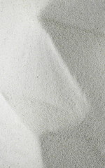 Gray Sand on the beach as background. Sand Texture. Gray sand. Background from fine sand.