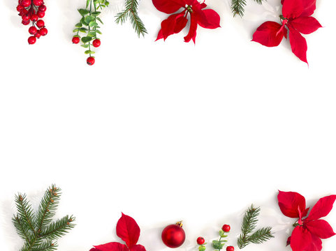 Christmas Decoration. Frame Of Flowers Of Red Poinsettia, Branch Christmas Tree, Ball, Red Berry On A White Background With Space For Text. Top View, Flat Lay