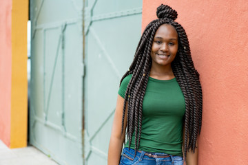 Beautiful african american young adult woman with amazing hairstyle