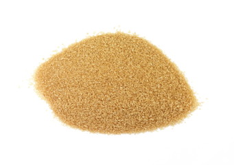 Closeup pile brown sugar isolated on white background. 