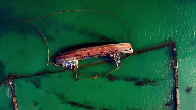 The contraband tanker washed ashore. Efforts to contain the spill, including an oil booms to cap the leak. December 8, 2019 in Odessa, Ukraine.