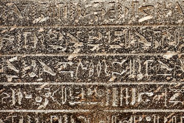 Egyptian hieroglyphs carved in sandstone