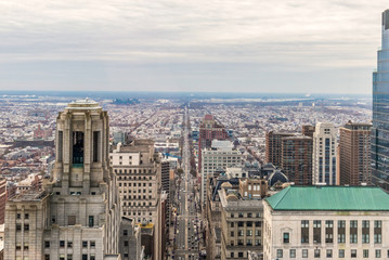 Philadelphia, Pennsylvania. City rooftop view with urban skyscrapers on a cloudy day