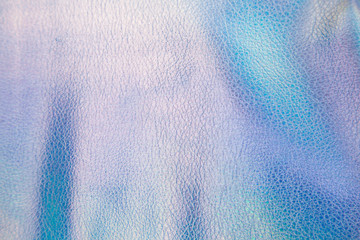 Colored shining festive Christmas background from artificial leather.