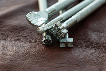 Close up of leather stamps in different shapes. Leather working tools