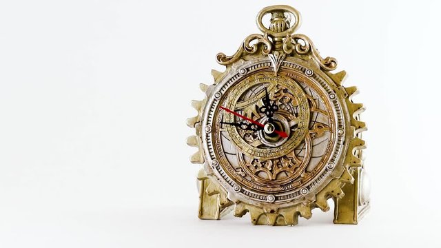 A Steam Punk Clock ticking every second Isolated on white background dial close-up Gold Gears 