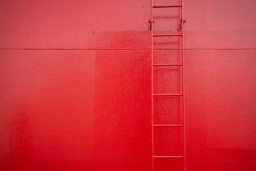 red ladder on a red boat