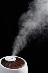 An Ultrasonic Humidifier on a Black Background