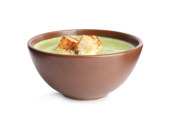 Delicious broccoli cream soup with croutons isolated on white