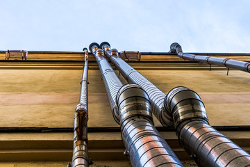 pipes on the wall of the house to drain water from the roofs