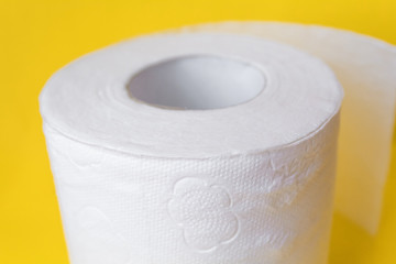 toilet paper on yellow background