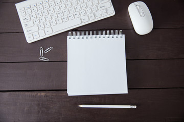 pen with notepad and keyboard