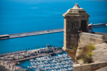 Beautiful wide aerial view of Alicante, Valencian Community, Spain with port of Alicante, beach and marina, with mountains and skyline, seen from Santa Barbara Castle on Mount Benacantil, sunny day