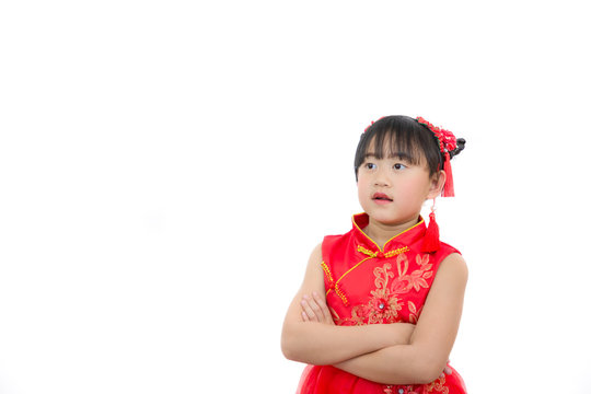 A picture of an Asian girl wearing a red Chinese dress in a white background. Concept Chinese new year for the love day and is a tradition in China every year.