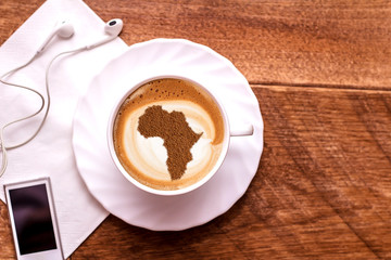 Cup of cappuccino with a picture of Africa