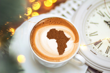 Cup of cappuccino with a picture of Africa