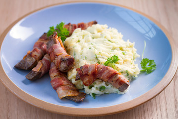 Lamb liver wrapped in bacon with mash potato