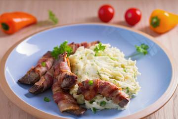 Lamb liver wrapped in bacon with mash potato
