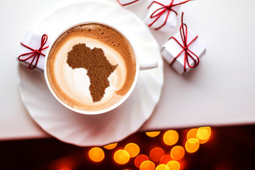Cup of cappuccino with a picture of Africa