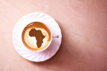 Cup of cappuccino with a picture of Africa