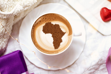 Cup of cappuccino with a picture of Africa