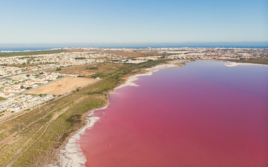 Fototapeta na wymiar Beautiful aerial wide vibrant summer view of las Salinas de Torrevieja, The Pink Lake Of Torrevieja, pink salt lagoon in Torrevieja, Costa Blanca, province of Alicante, Spain