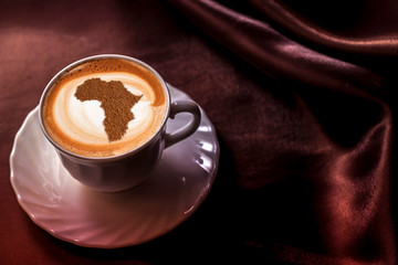 Cup of cappuccino with a picture of Africa