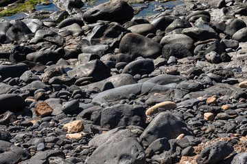 Volcanic rocks structure smooth lava stone background texture.