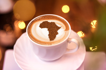 Cup of cappuccino with a picture of Africa