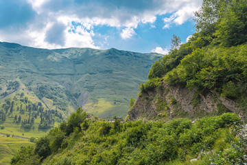 Fototapeta na wymiar Dangerous turn on the Georgian Military road in the Caucasus mountains