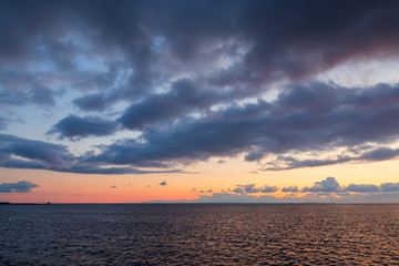 Beautiful sunset seascape. Sea view and clouds at sunset. Great for background.