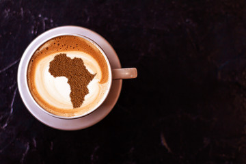 Obraz na płótnie Canvas Cup of cappuccino with a picture of Africa
