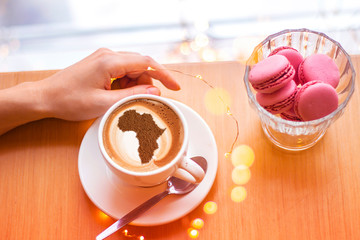 Cup of cappuccino with a picture of Africa
