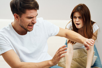 Obraz premium young couple in t-shirts chatting