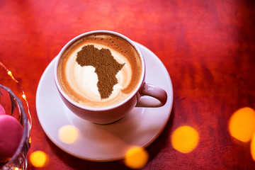Cup of cappuccino with a picture of Africa