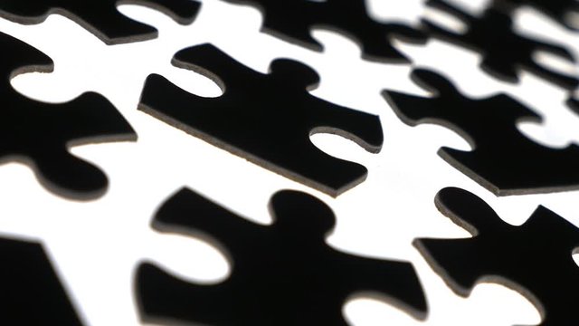 Puzzle pieces on white surface