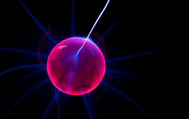 ball with electric neon pulses on a dark background, blur, selective focus