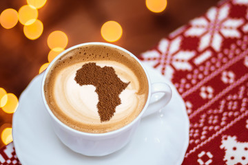 Cup of cappuccino with a picture of Africa
