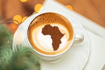 Cup of cappuccino with a picture of Africa