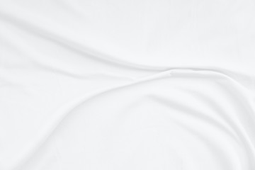 Top view Abstract White cloth background with soft waves.Wave and curve overlapping with different shadow of color,white fabric, crumpled fabric.