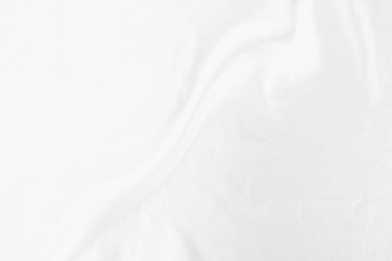 Top view Abstract White cloth background with soft waves.Wave and curve overlapping with different shadow of color,white fabric, crumpled fabric.