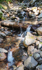 Shimmering cascades and bountiful boulders on the North Fork Sauk River in the Summertime off the Mountain Loop Highway in Silverton Washington State Snohomish County