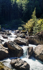 Shimmering cascades and bountiful boulders on the North Fork Sauk River in the Summertime off the Mountain Loop Highway in Silverton Washington State Snohomish County