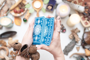 Tarot cards in fortune teller hands close up. Future reading.