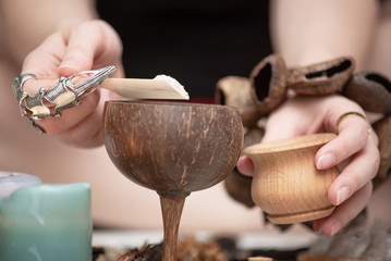 Witch doctor preparing a magic potion concept. Witchcraft.